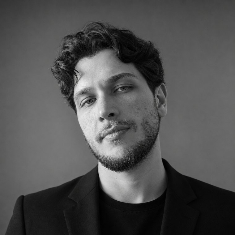 Ahmet Faruk Yilmaz, founder of Asphia, in a black and white studio portrait